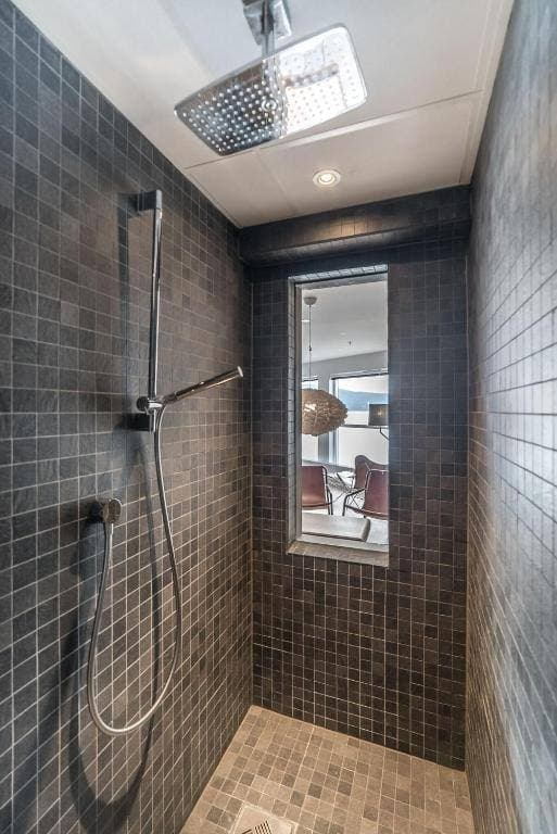 Rain shower with dark mosaic tiles