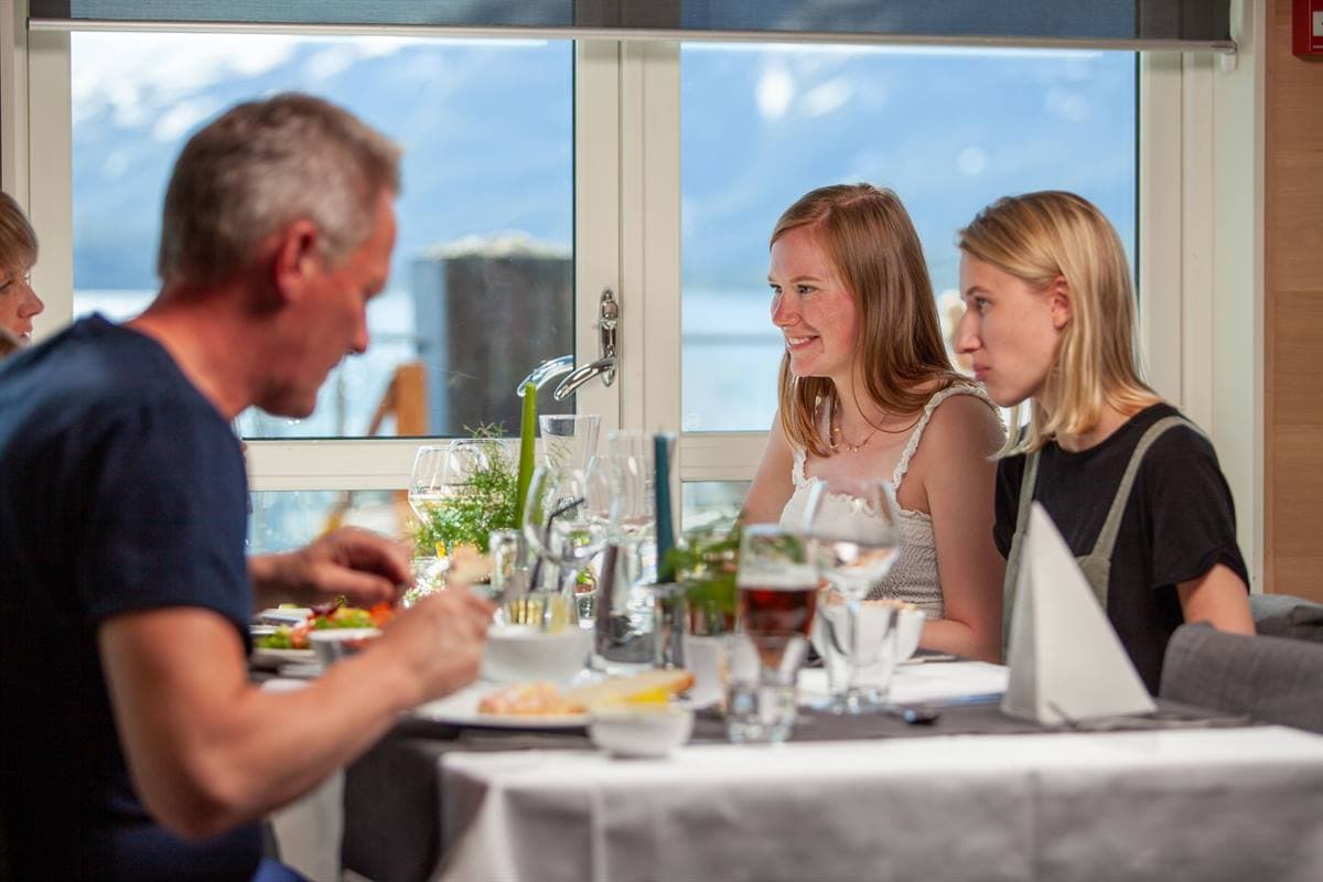 Guests at a window table in Marmælen Restaurant