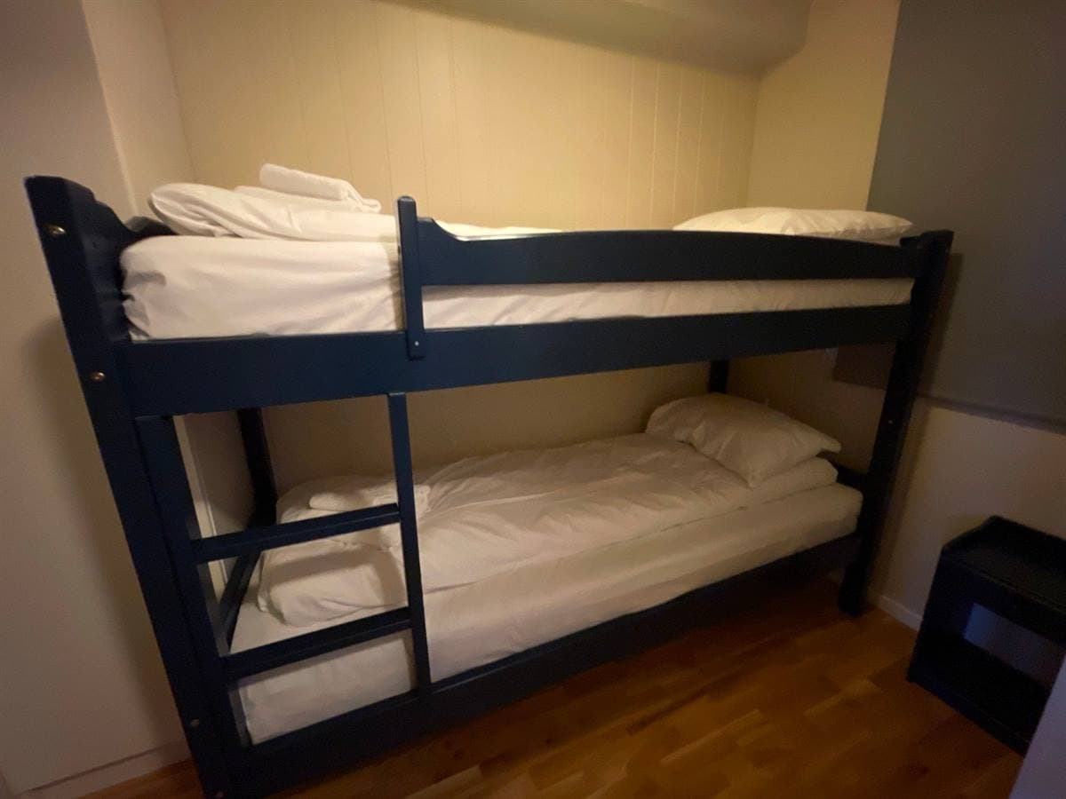 Apartment bedroom with a wooden bunk bed