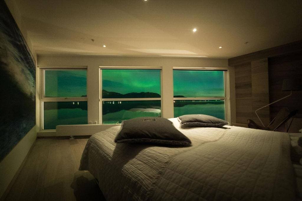 Northern lights through the windows of a Premium Double Room at night